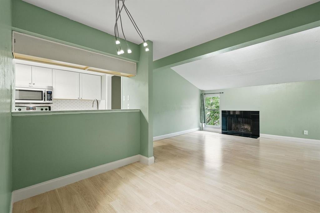 12824 Midway Road, Unit 2136 Dallas, TX 75244 - Photo 14 of 40 a view of a kitchen with microwave and cabinets