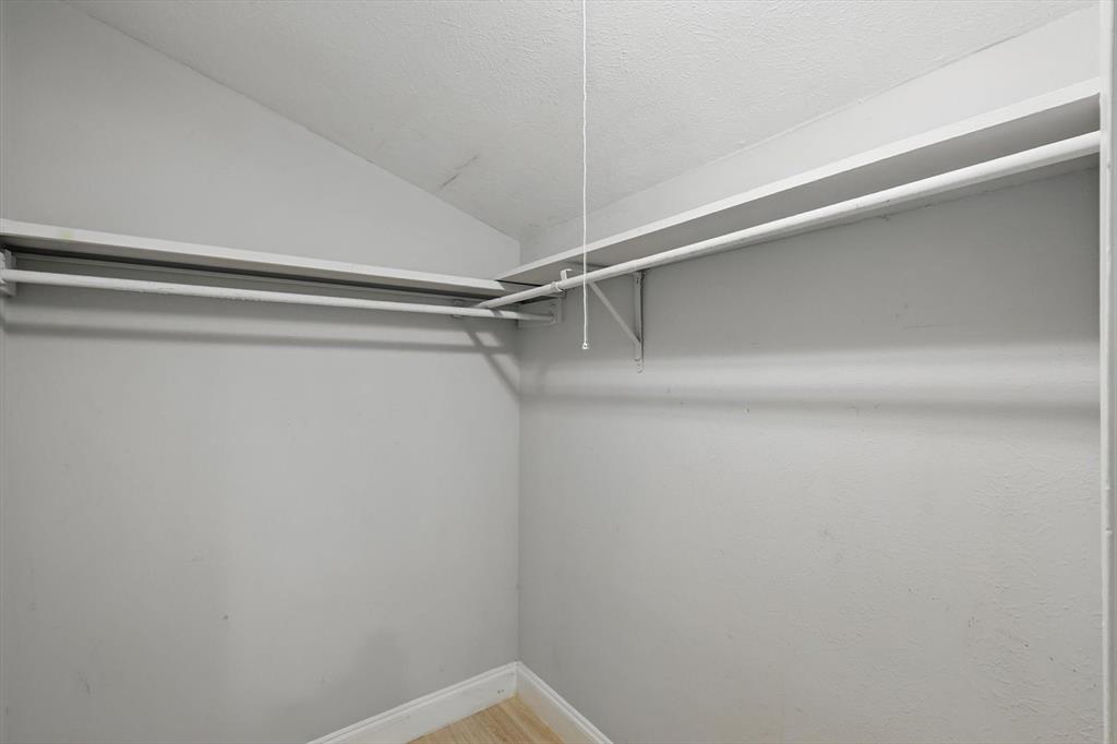 12824 Midway Road, Unit 2136 Dallas, TX 75244 - Photo 27 of 40 a view of a room with shelf on the wall