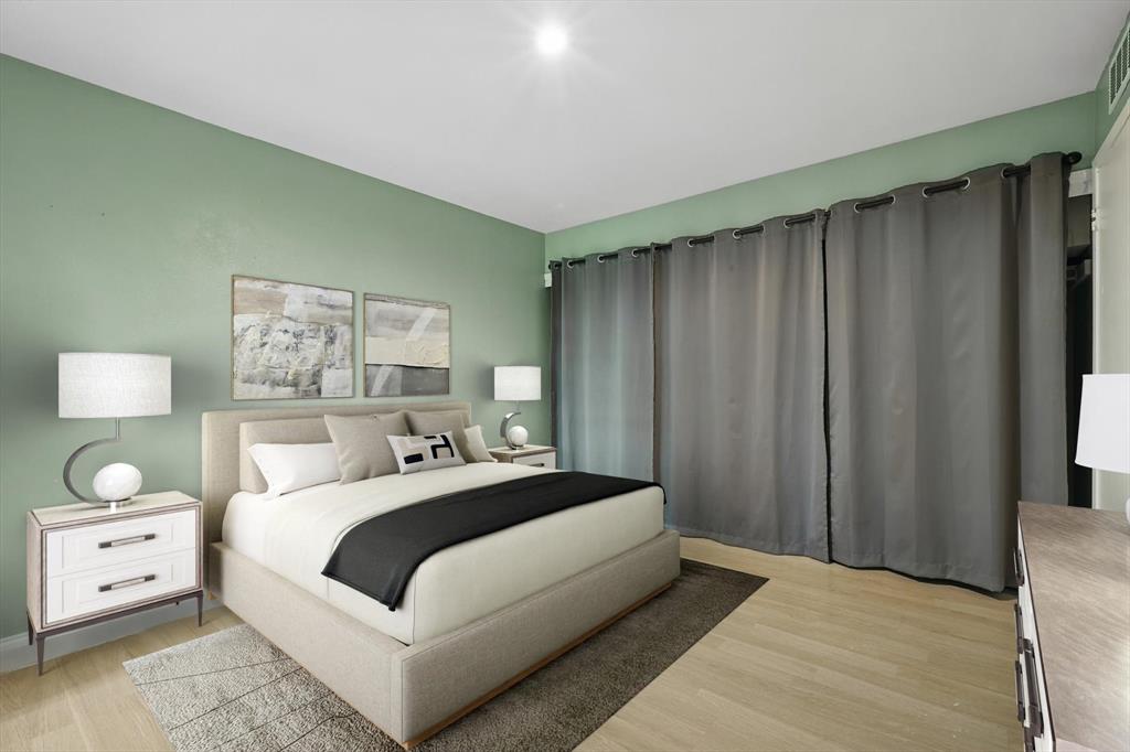 12824 Midway Road, Unit 2136 Dallas, TX 75244 - Photo 29 of 40 a bedroom with a large bed and a large window