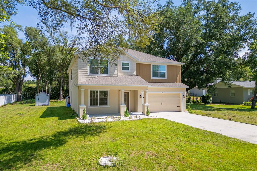 4331 Wayne Road Fruitland Park, FL 34731 - Photo 3 of 46 a front view of house with yard and green space