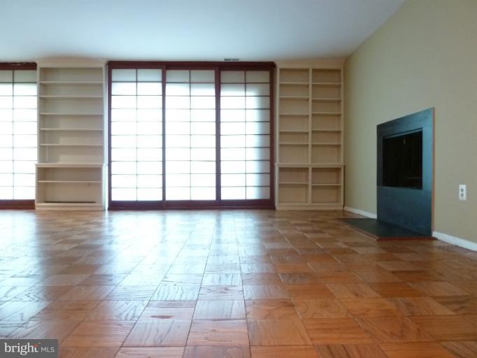 1782 Ivy Oak Square, Unit 79 Reston, VA 20190 - Photo 1 of 23 wooden floor in an empty room with a window