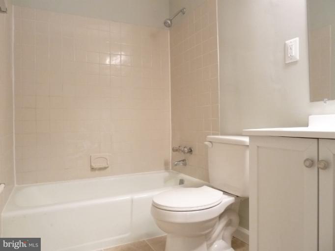 1782 Ivy Oak Square, Unit 79 Reston, VA 20190 - Photo 13 of 23 a white toilet sitting next to a bath tub