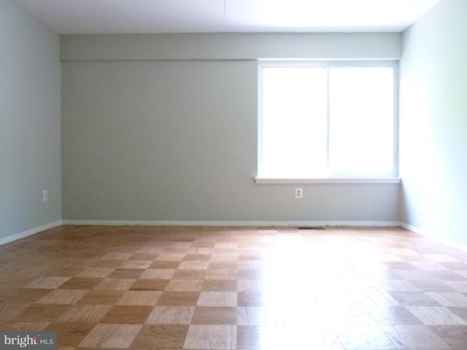 1782 Ivy Oak Square, Unit 79 Reston, VA 20190 - Photo 15 of 23 an empty room with a window