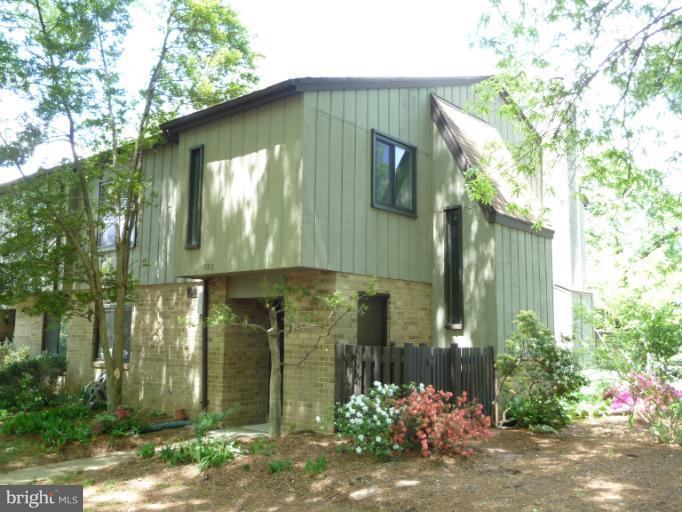 1782 Ivy Oak Square, Unit 79 Reston, VA 20190 - Photo 23 of 23 a front view of a house with garden