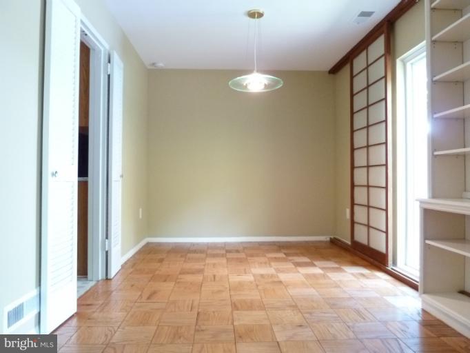 1782 Ivy Oak Square, Unit 79 Reston, VA 20190 - Photo 5 of 23 a view of an empty room with a window