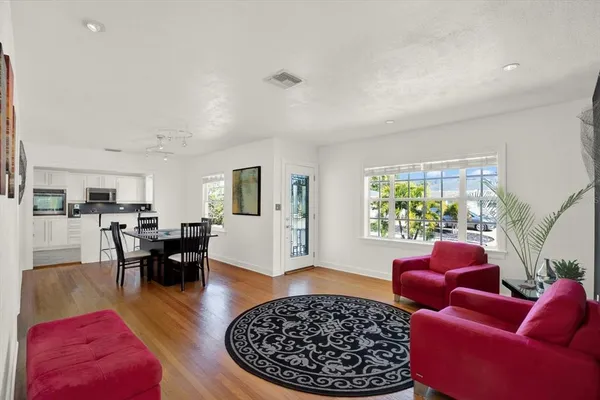 a living room with furniture or couch and a table