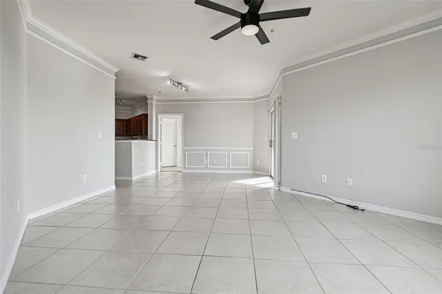 a view of a livingroom with a dishwasher cabinets and window
