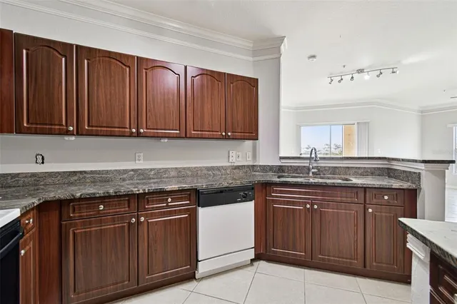 a kitchen with stainless steel appliances granite countertop a stove and cabinets