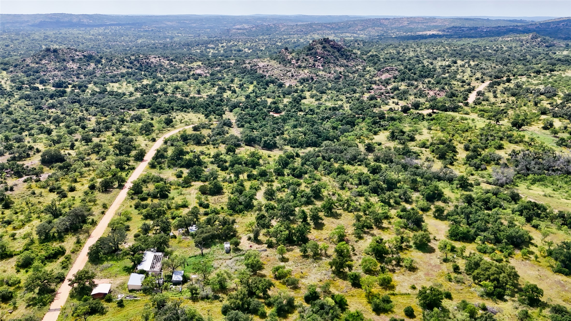 18248 Bode Peak Road Pontotoc, TX 76869 - Photo 14 of 17 Discover expansive natural beauty with rolling hills and abundant greenery.