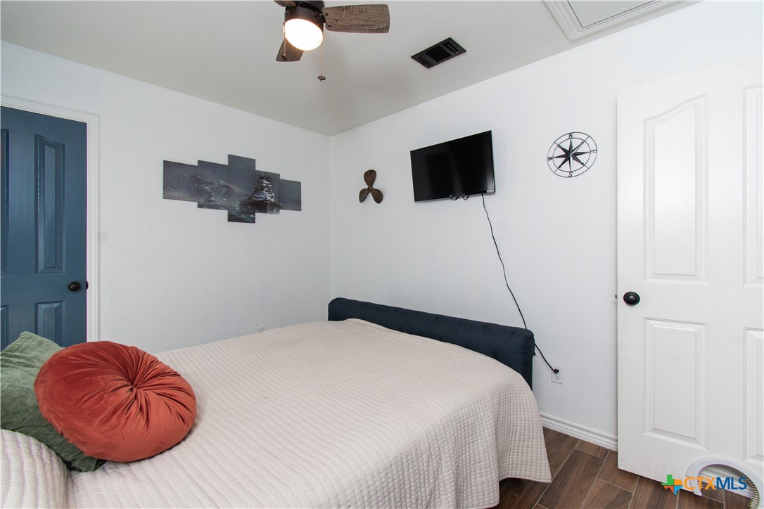 519 Pleasant View Road Troy, TX 76579 - Photo 11 of 30 a bedroom with a bed and a flat screen tv