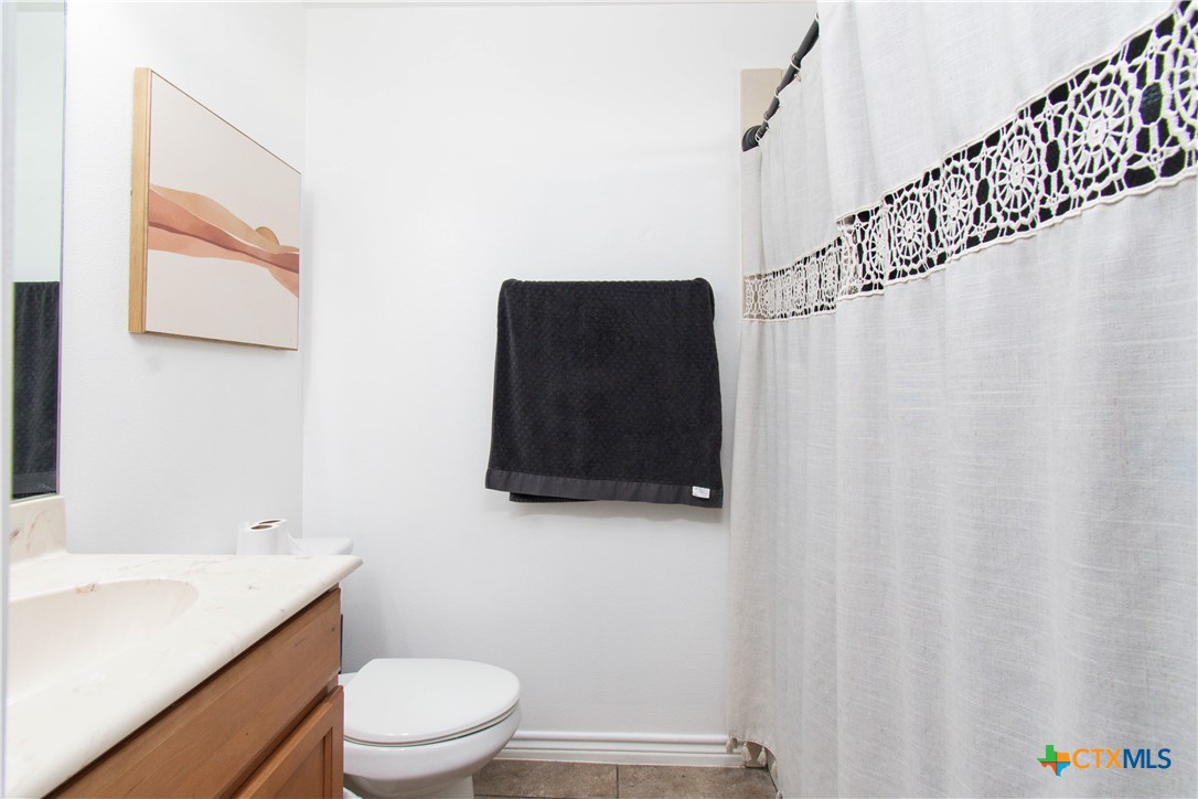 519 Pleasant View Road Troy, TX 76579 - Photo 22 of 30 a bathroom with a toilet and a sink
