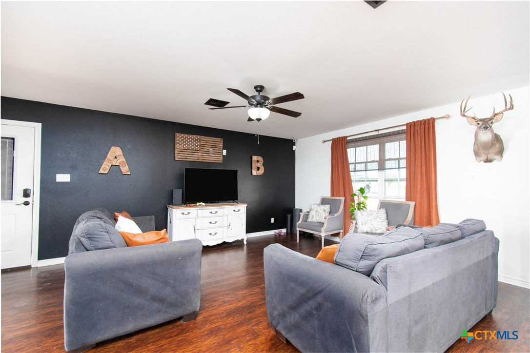 519 Pleasant View Road Troy, TX 76579 - Photo 3 of 30 a living room with furniture and a flat screen tv