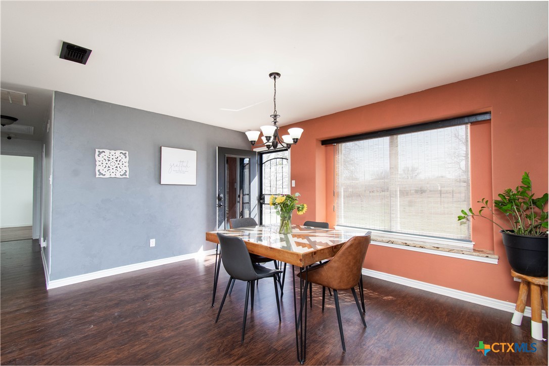 519 Pleasant View Road Troy, TX 76579 - Photo 8 of 30 a dining room with furniture window and wooden floor