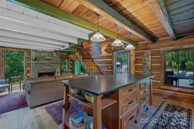 a view of kitchen with a table and chairs