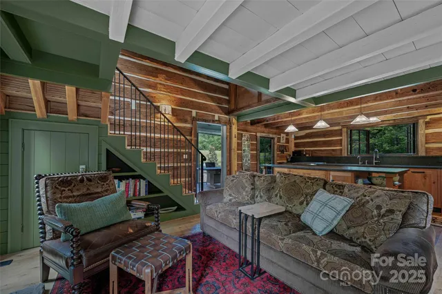 a roof deck with couch and chairs