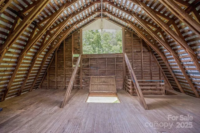 a view of an empty room and wooden floor