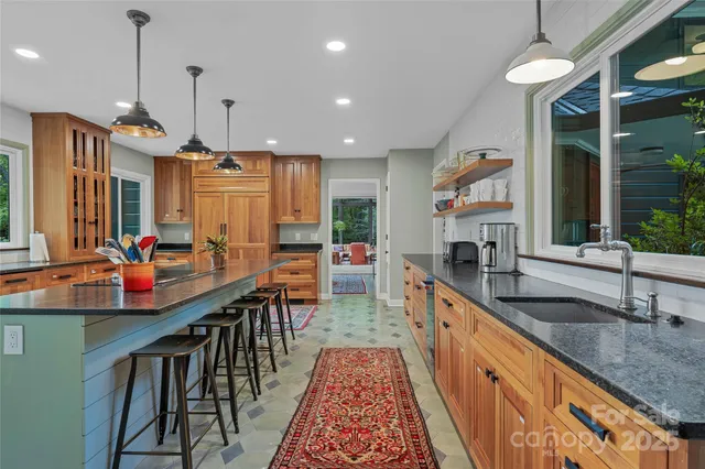 a large kitchen with lots of counter space and a sink