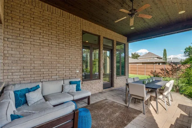 a outdoor living space with furniture and a flat screen tv