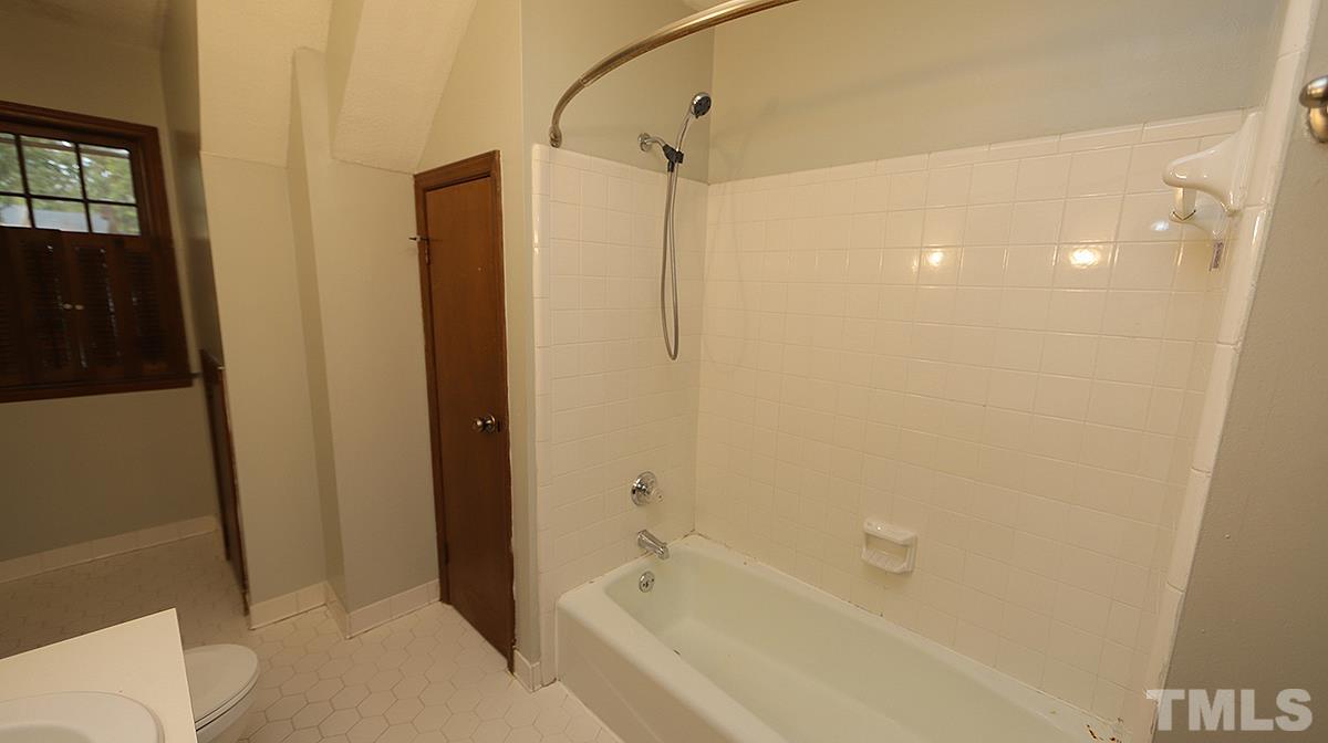 7300 Mill Ridge Road Raleigh, NC 27613 - Photo 22 of 25 a bathroom with a bathtub and a shower