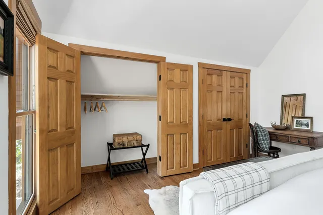 a bedroom with a bed and a fireplace