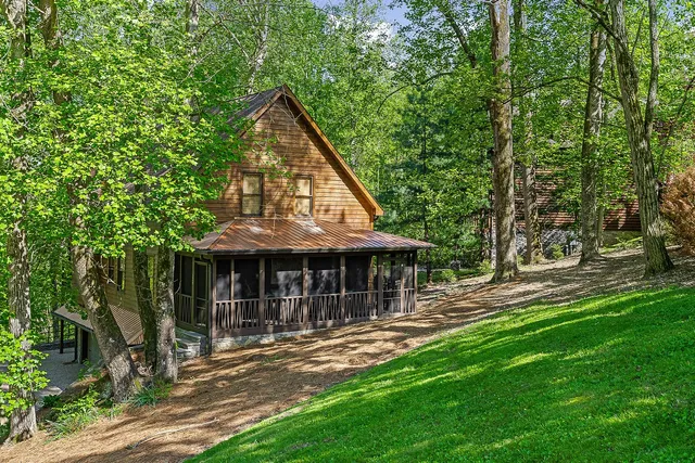 a view of a house with a yard and sitting area