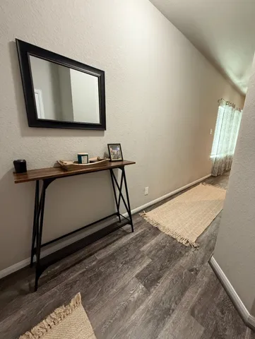 a bathroom with a sink a mirror and vanity