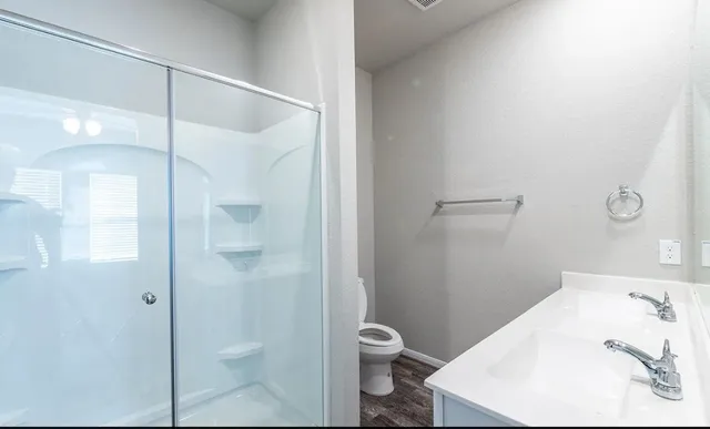 a bathroom with a sink and toilet