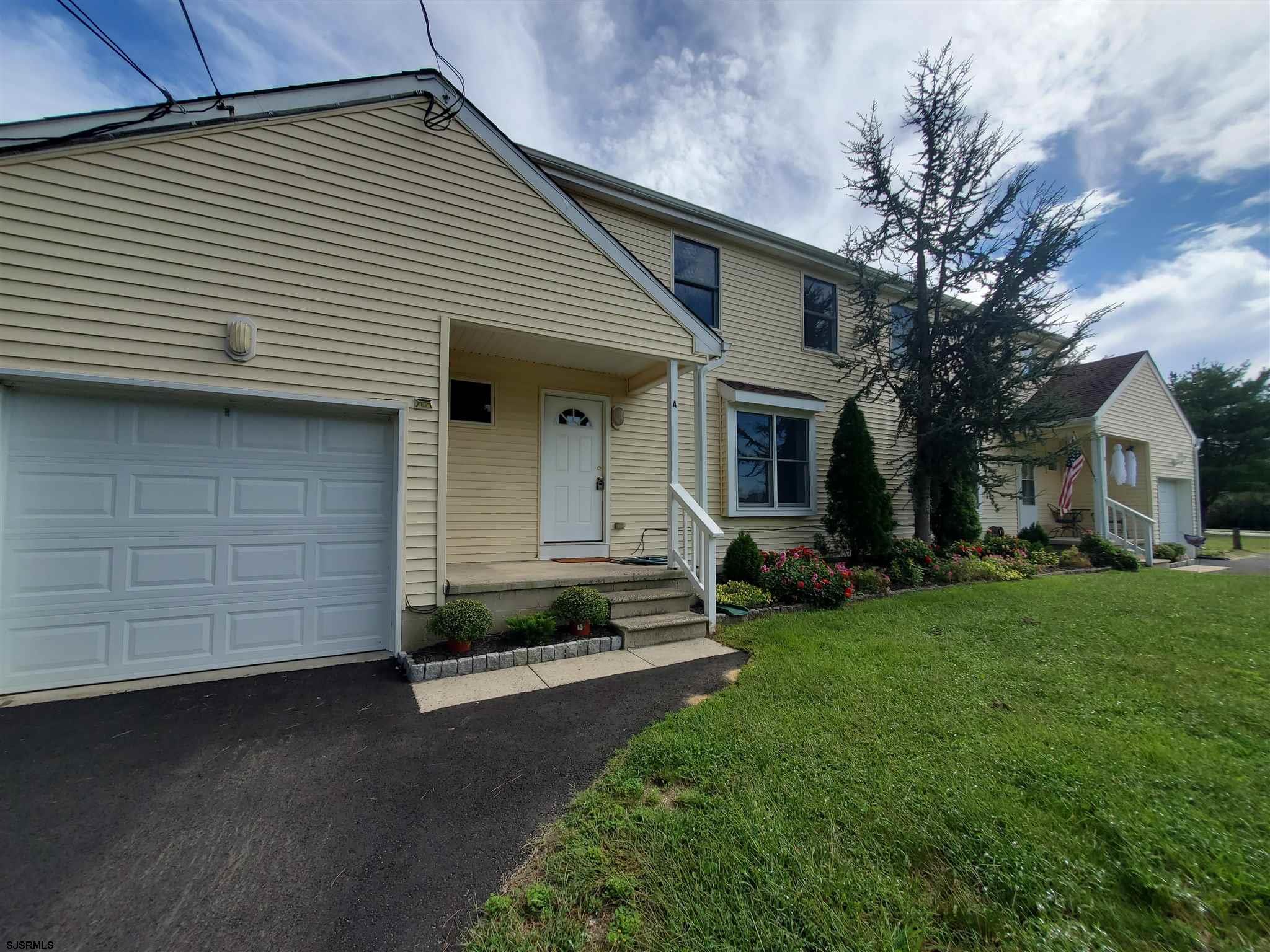 1 North Meadow Ridge Lane Woodbine, NJ 08270 - Photo 1 of 12 a front view of a house with a yard
