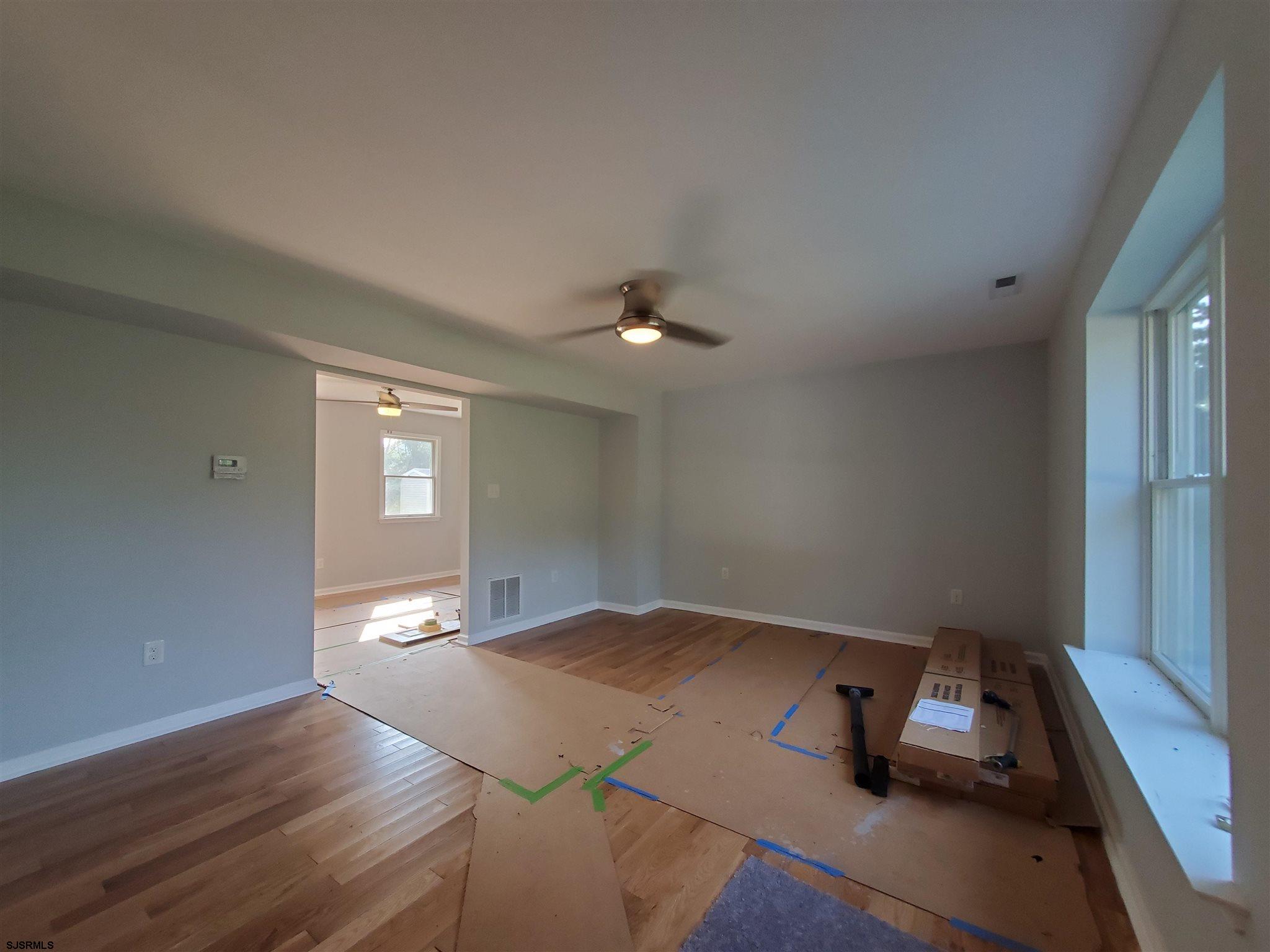 1 North Meadow Ridge Lane Woodbine, NJ 08270 - Photo 4 of 12 a room with window and wooden floor