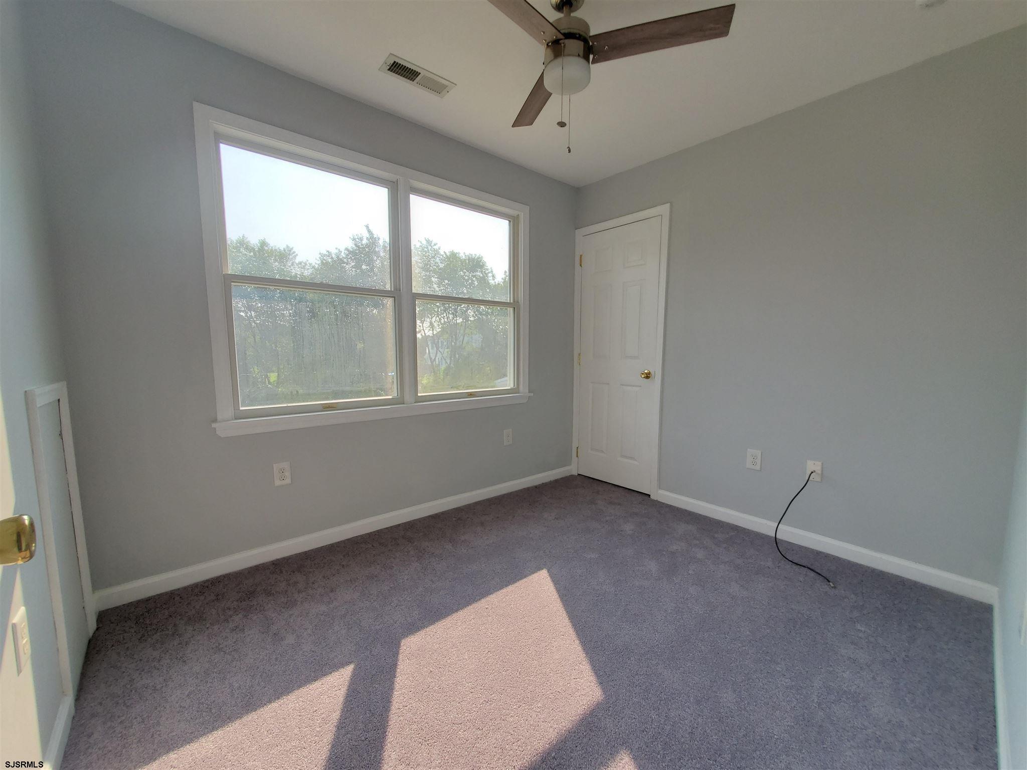 1 North Meadow Ridge Lane Woodbine, NJ 08270 - Photo 5 of 12 an empty room with a window