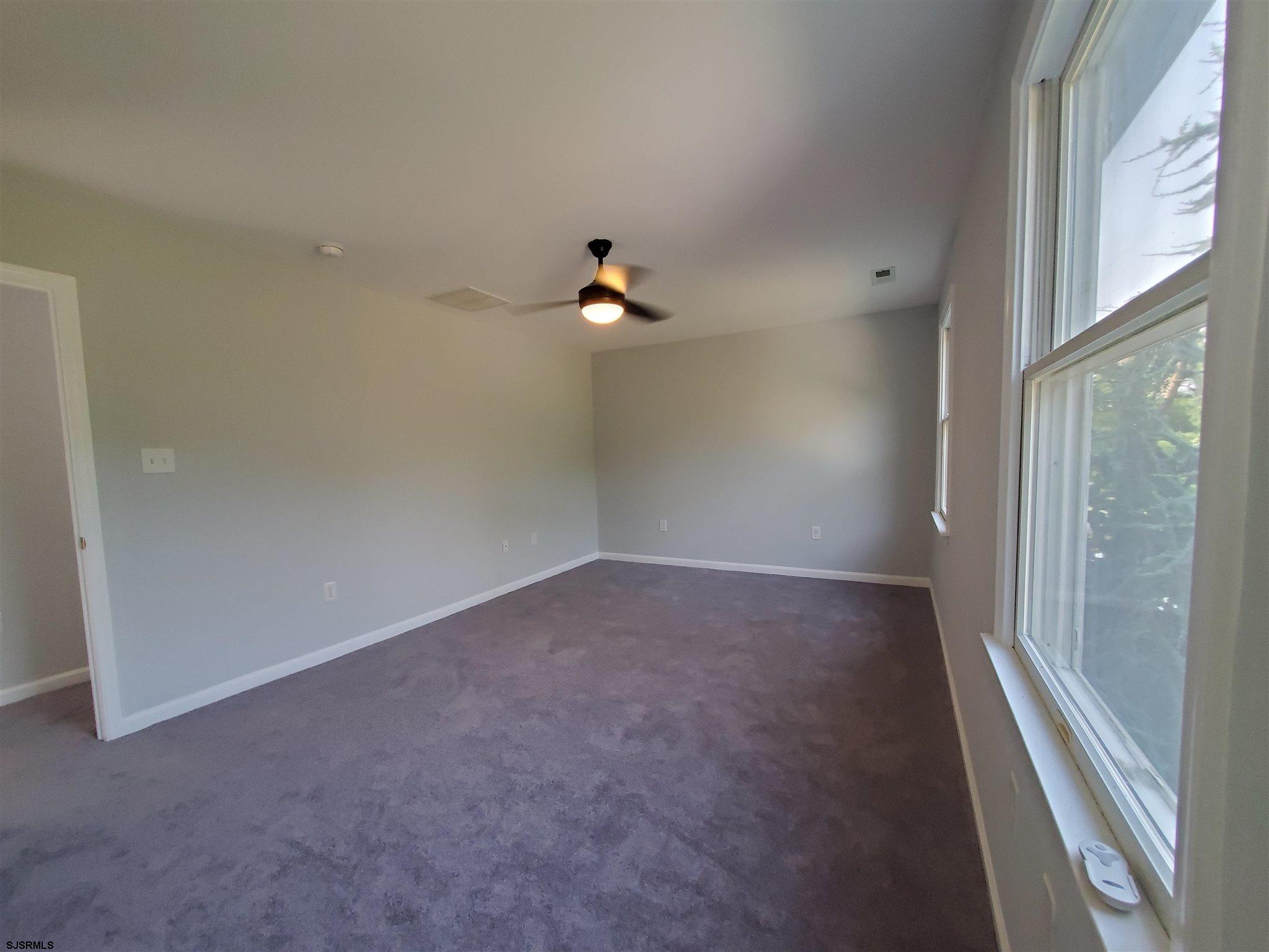 1 North Meadow Ridge Lane Woodbine, NJ 08270 - Photo 6 of 12 a view of a room with a ceiling fan and window