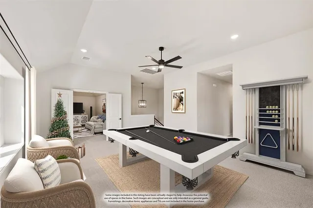 a living room with furniture a table and kitchen view