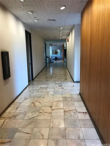 a large room with lots of furniture and a rug