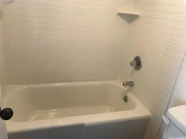 a close up of a bathtub in a bathroom