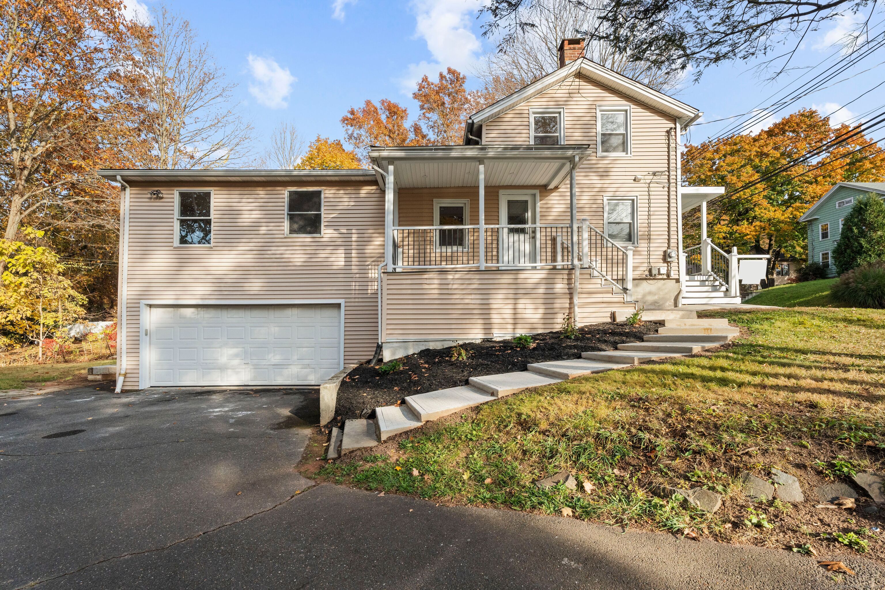 58 Constitution Street Wallingford, CT 06492 - Photo 1 of 1 a front view of a house with a yard