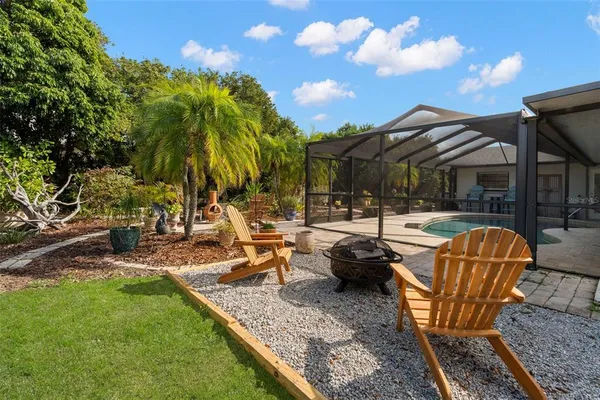 a view of a swimming pool and lounge chairs