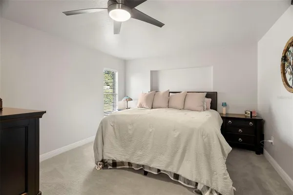 a bedroom with a bed and a table
