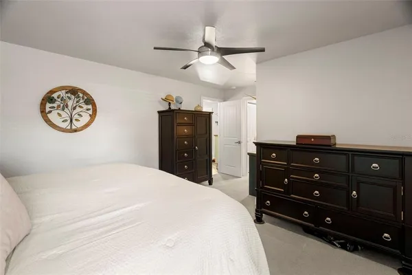 a bedroom with a bed and a table