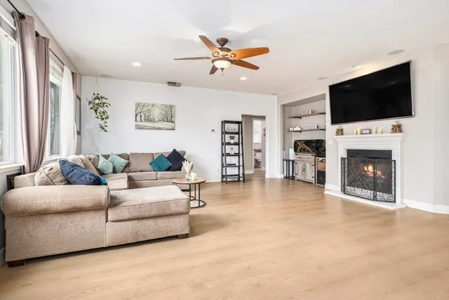 a living room with furniture and a fireplace