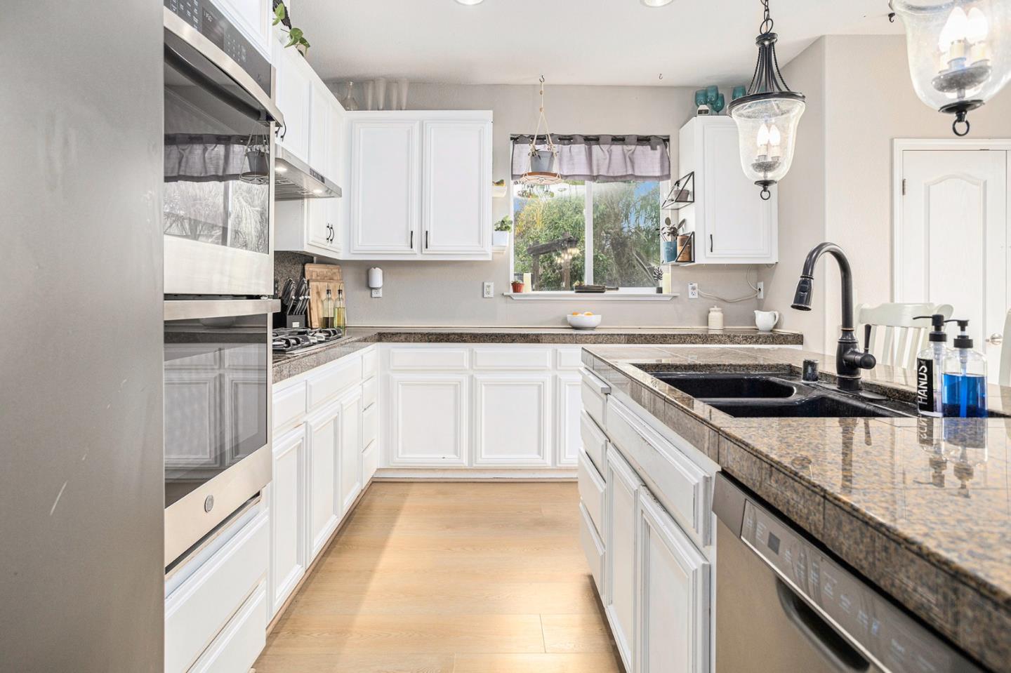 130 Ridge Crest Court Oakley, CA 94561 - Photo 16 of 59 a kitchen with a sink stove and cabinets