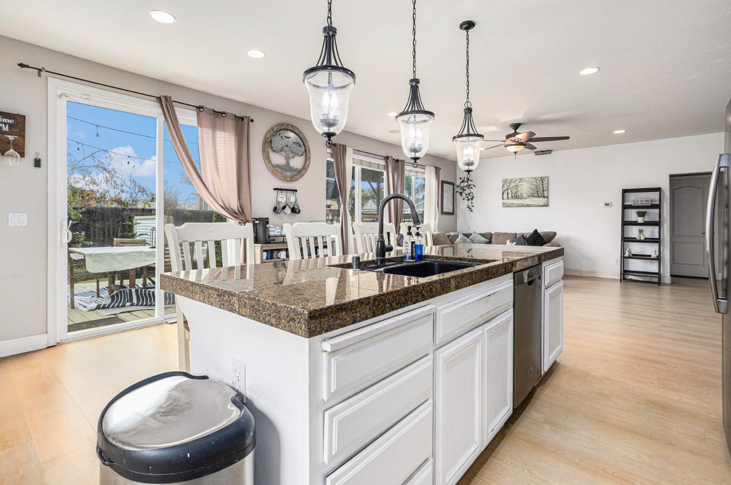 130 Ridge Crest Court Oakley, CA 94561 - Photo 17 of 59 a kitchen with stainless steel appliances granite countertop a sink a stove and a wooden floors