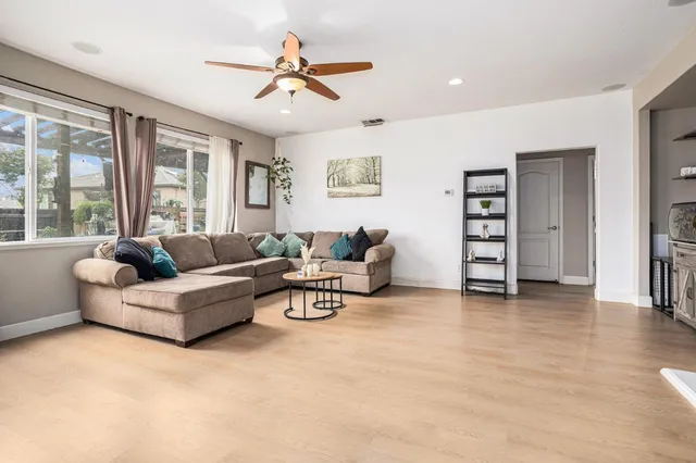 a view of a livingroom with furniture and a chandelier