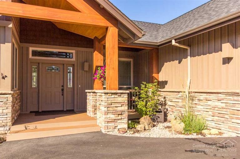 22 Oregon Loop Sunriver, OR 97707 - Photo 2 of 25 a front view of a house with a outdoor space