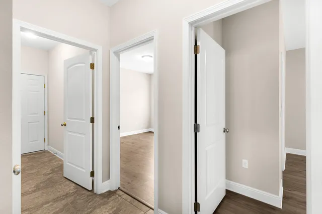 a view of a bathroom with wooden floor