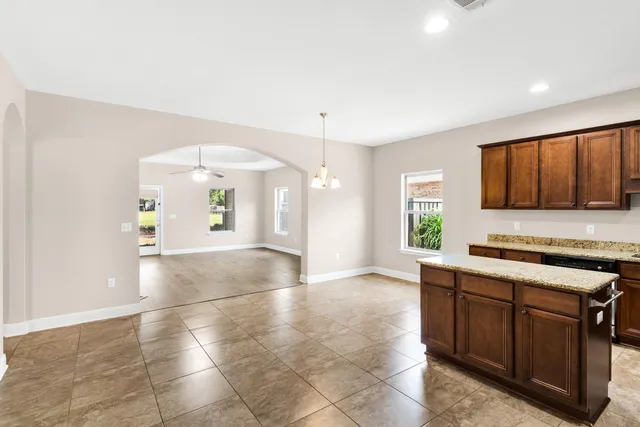 a view of a kitchen with a sink and a window