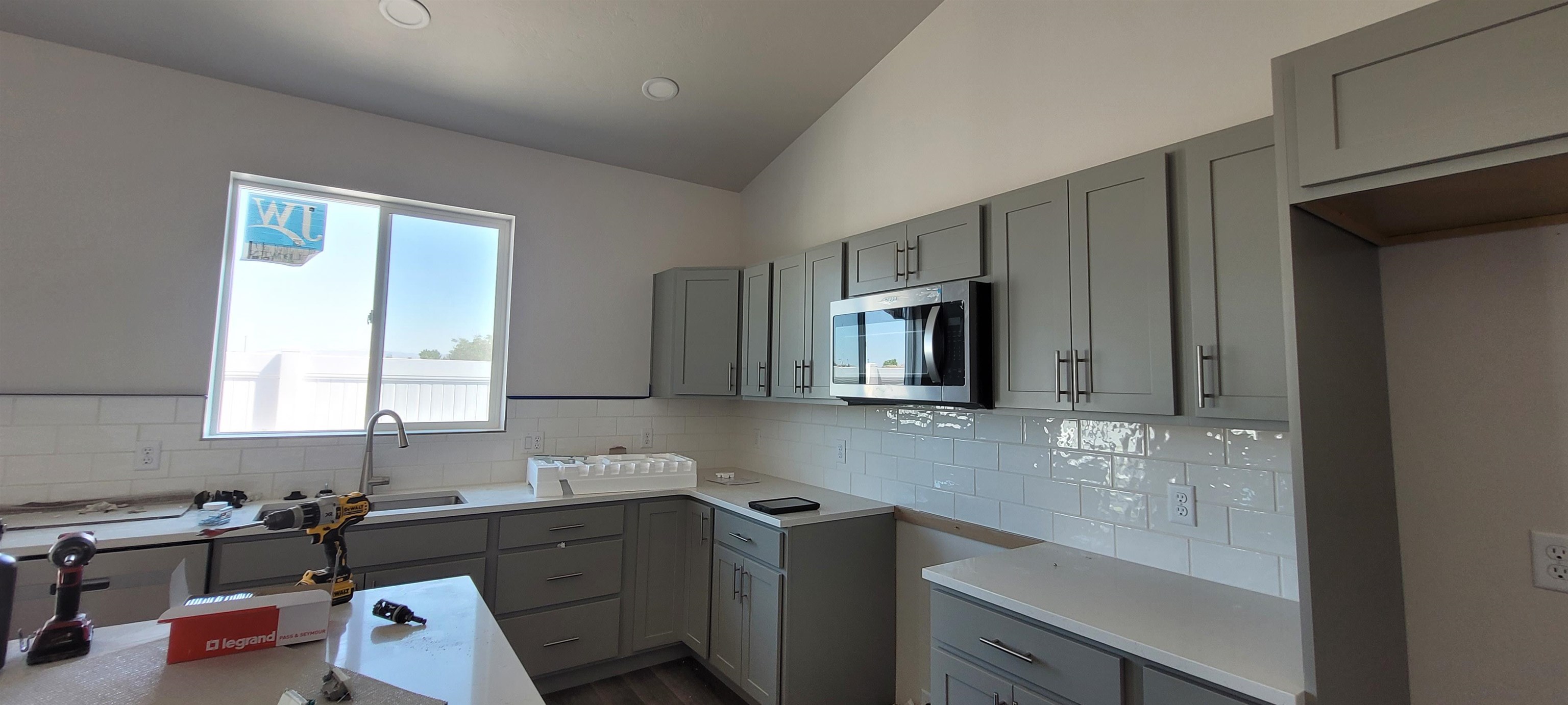 2458 Ross Road Grand Junction, CO 81505 - Photo 3 of 17 a kitchen with a sink stove and cabinets