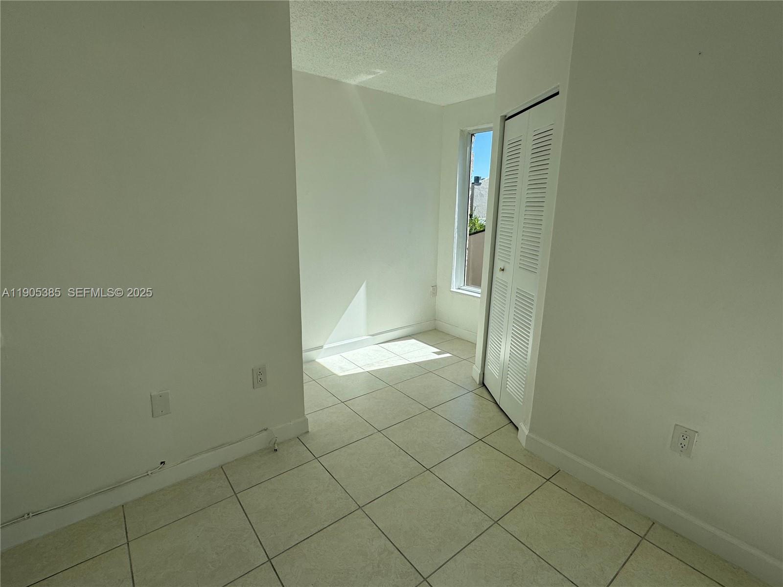 8585 Northwest 6th Lane, Unit 9208 Miami, FL 33126 - Photo 11 of 22 a bathroom with a granite countertop shower and a toilet