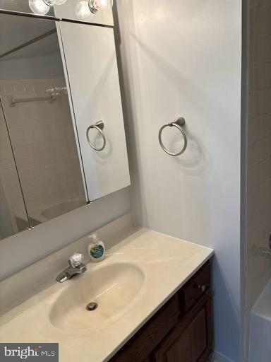 6803 Wild Rose Court Springfield, VA 22152 - Photo 27 of 49 a bathroom with a sink and a mirror