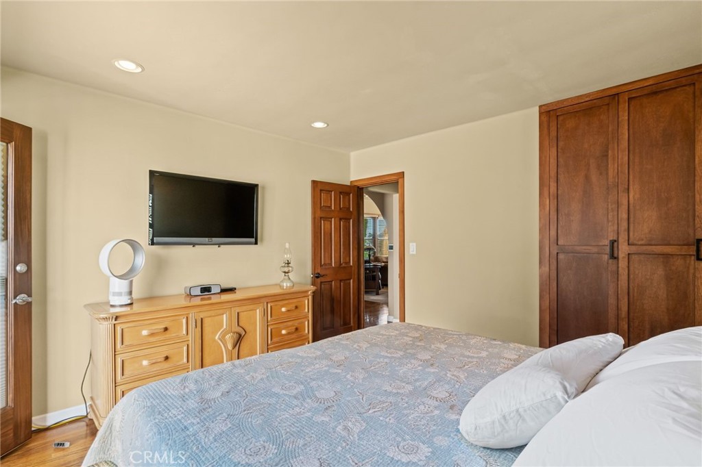 147 Trafalgar Lane San Clemente, CA 92672 - Photo 22 of 37 a bedroom with a bed and a flat screen tv