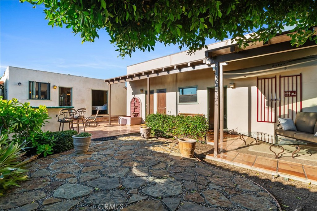 147 Trafalgar Lane San Clemente, CA 92672 - Photo 26 of 37 a front view of house with yard outdoor seating and barbeque oven